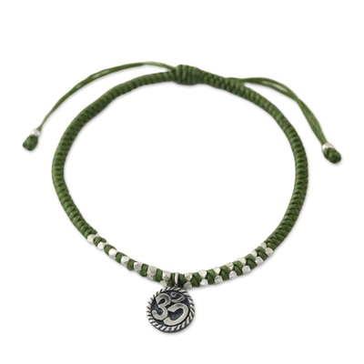 Silver charm bracelet, 'Ancient Om in Green' - Silver Om Charm Bracelet on Braided Green Cords