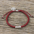 Silver accented cord bracelet, 'New Day' - Dark Red Cord Flower Motif Bracelet with Silver Peace Charm