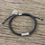 Silver accented cord bracelet, 'Daybreak' - Silver Flower Motif Peace Symbol Charm Black Cord Bracelet