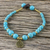 Brass beaded charm bracelet, 'Andaman Waves' - Turquoise Colored Bead Bracelet with Brass Charm (image 2) thumbail
