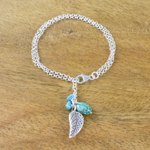 Silver charm bracelet, 'Lively Leaf' - Silver and Recon Turquoise Leaf Bracelet from Thailand