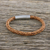 Leather wristband bracelet, 'Magical Braid in Saddle' - Light Brown Leather Braided Bracelet Crafted in Thailand