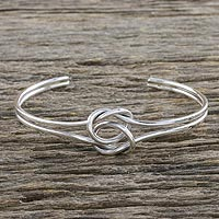 Sterling silver cuff pendant bracelet, 'Happy Together' - Sterling Silver Wire Cuff Bracelet with Center Knot