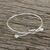 Sterling silver bangle pendant bracelet, 'Tie the Knot' - Sterling Silver Wire Bangle Bracelet with Knot Pendant (image 2) thumbail