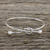 Sterling silver bangle pendant bracelet, 'Tie the Knot' - Sterling Silver Wire Bangle Bracelet with Knot Pendant (image 2b) thumbail