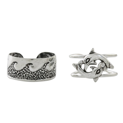 Sterling silver ear cuffs, 'Dolphins in the Ocean' - Dolphin and Wave Motif Sterling Silver Ear Cuffs