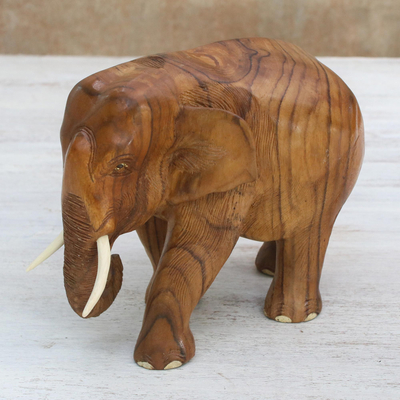 Teak wood sculpture, 'Go For a Walk' (left) - Teak Wood Sculpture of a Left-Facing Elephant from Thailand