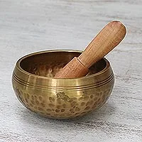 Brass singing bowl, 'Singing Healer' - Brass Hammered Singing Bowl with Raintree Wood Striker