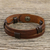 Men's leather wristband bracelet, 'Commander in Dark Brown' - Men's Dark Brown Leather Wristband Bracelet with Brass Snap thumbail