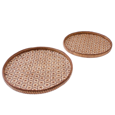 Bamboo and rattan trays, 'Presenting Pikul' (8 and 9 inch, pair) - Handcrafted Woven Flower Motif Rattan Trays (Pair)