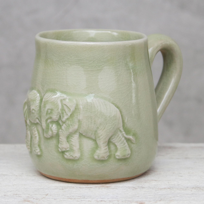 Celadon ceramic mug, 'Playful Elephants' - Elephant-Themed Celadon Ceramic Mug from Thailand