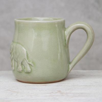 Celadon ceramic mug, 'Playful Elephants' - Elephant-Themed Celadon Ceramic Mug from Thailand