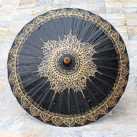 Cotton parasol, 'Black Gold Sun' - Black and Gold Oil Painted Thai Parasol with Bamboo Frame