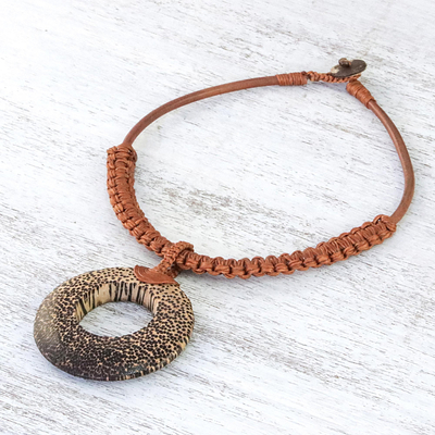 Wood and leather pendant necklace, 'Earth Ring in Burnt Sienna' - Handcrafted Coconut Wood and Leather Cord Pendant Necklace