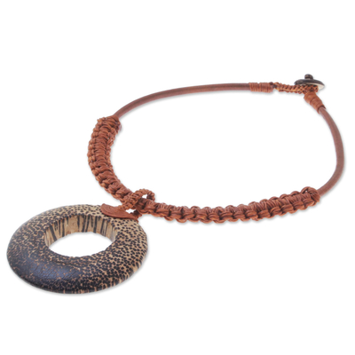Wood and leather pendant necklace, 'Earth Ring in Burnt Sienna' - Handcrafted Coconut Wood and Leather Cord Pendant Necklace