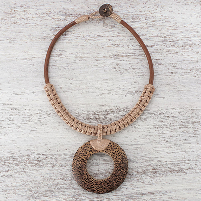 Wood and leather pendant necklace, 'Earth Ring in Ecru' - Handcrafted Coconut Wood and Leather Cord Pendant Necklace