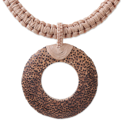 Wood and leather pendant necklace, 'Earth Ring in Ecru' - Handcrafted Coconut Wood and Leather Cord Pendant Necklace