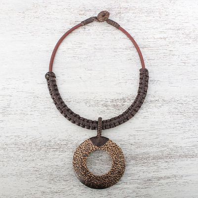 Wood and leather pendant necklace, 'Earth Ring in Dark Brown' - Handcrafted Coconut Wood and Leather Cord Pendant Necklace