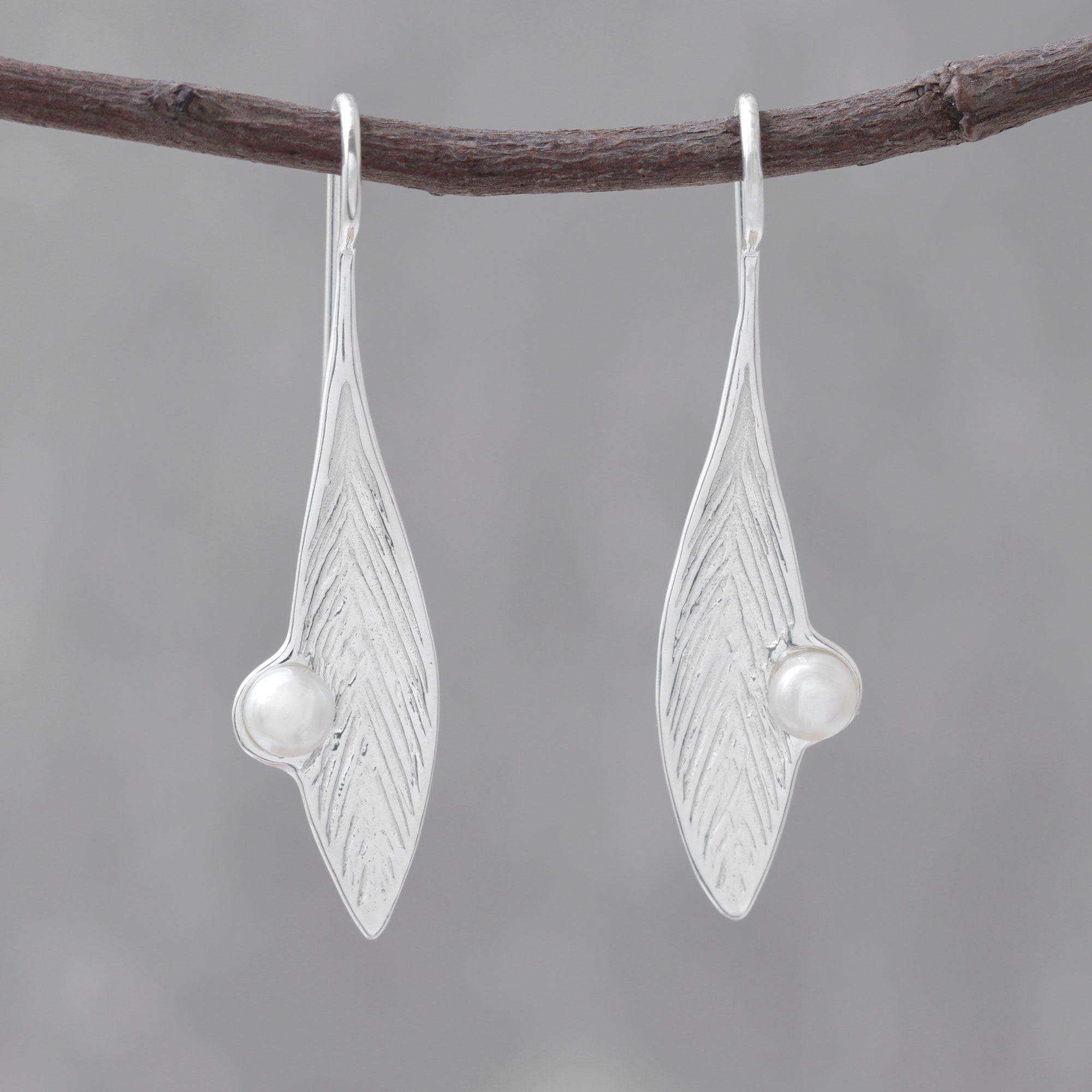 Silver leaf and pearl dangly earrings handmade sterling silver textured leaves with a pink fresh water cultured pearl on hook wires