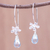 Blue topaz dangle earrings, 'Daisy Glitter' - Floral Faceted Blue Topaz Dangle Earrings from Thailand