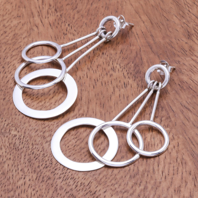 Sterling silver dangle earrings, 'Lively Rings' - Sterling Silver Dangle Earrings with Ring Shapes