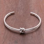 Sterling silver cuff bracelet, 'Love Knot' - Knot Motif Sterling Silver Cuff Bracelet from Thailand