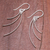 Sterling silver dangle earrings, 'Charming Swoop' - Swooping Sterling Silver Dangle Earrings from Thailand