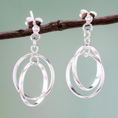 Sterling silver dangle earrings, 'Unity Rings' - Circular Sterling Silver Dangle Earrings from Thailand