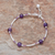 Amethyst beaded bracelet, 'Violet Sound' - Amethyst Beaded Bracelet with a Bell Charm from Thailan