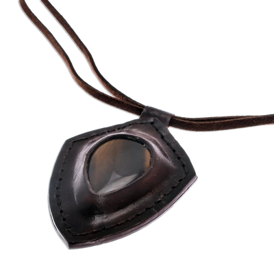 Tiger's eye pendant necklace, 'Bold Shield' - Tiger's Eye and Leather Pendant Necklace from Thailand
