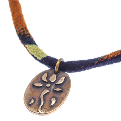 Brass pendant necklace, 'Fiery Lotus Oval' - Oval Lotus Flower Brass Pendant Necklace in Orange