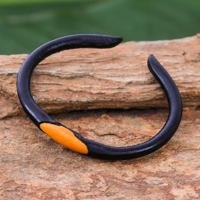 Leather cuff bracelet, 'Black-Orange Eye' - Black and Orange Leather Cuff Bracelet from Thailand