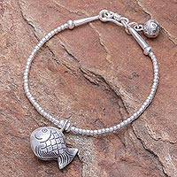 Silver beaded charm bracelet, 'Singing Hill Tribe Goldfish' - Karen Hill Tribe Silver Goldfish Bracelet with Ringing Bells