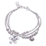Silver beaded charm bracelet, 'Singing Blossom' - Thai Karen Hill Tribe Silver Floral Bracelet with a Bell