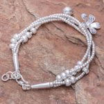 Silver beaded charm bracelet, 'Singing Blossom' - Thai Karen Hill Tribe Silver Floral Bracelet with a Bell