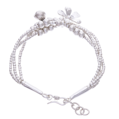 Silver beaded charm bracelet, 'Singing Blossom' - Thai Karen Hill Tribe Silver Floral Bracelet with a Bell
