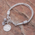 Silver charm bracelet, 'Floral Weave' - Thai Karen Hill Tribe Silver Beaded Floral Charm Bracelet