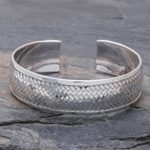 Sterling silver cuff bracelet, 'Weaving Tales' - Sterling Silver Cuff Bracelet with Woven Motif