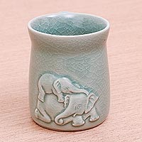 Celadon ceramic mug, 'Elephant Play' - Elephant Motif Celadon Ceramic Mug from Thailand