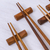 Teak wood chopsticks set, 'Authentic Meal' (set of 4) - Hexagonal Teak Chopstick Set of 4 with Rests (image 2c) thumbail