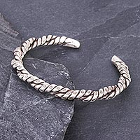 Sterling silver cuff bracelet, 'With a Twist' - Floral Stamped Twisted Sterling Silver Cuff Bracelet