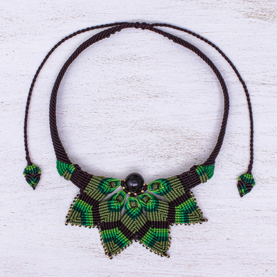 Garnet macrame pendant necklace, 'Bohemian Star' - Garnet Macrame Pendant Necklace from Thailand
