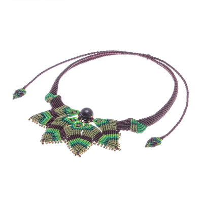 Garnet macrame pendant necklace, 'Bohemian Star' - Garnet Macrame Pendant Necklace from Thailand