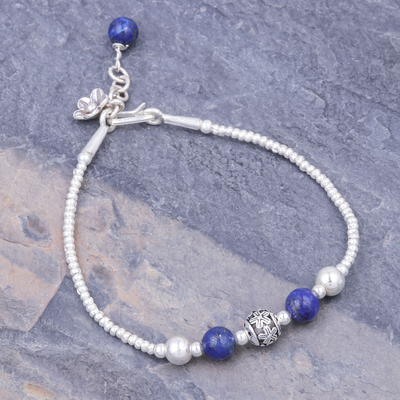 Lapis lazuli beaded bracelet, 'Flora Bead in Blue' - Hand Threaded Sterling Silver Lapis Lazuli Beaded Bracelet