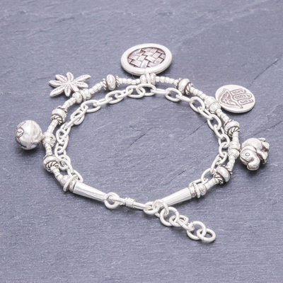 Sterling silver charm bracelet, 'Ethnic Charm' - Hand Crafted Sterling Silver Charm Bracelet