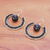Beaded dangle earrings, 'Universal Sun in Black' - Handcrafted Glass Beaded Circle Earrings