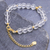 Gold-plated quartz charm bracelet, 'Crystal Night' - Handcrafted Gold-Plated Star Charm Bracelet from Thailand