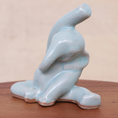 Celadon ceramic figurine, 'Head to Knee' - Hand Crafted Ceramic Elephant Yoga-Themed Figurine