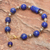 Gold-plated lapis lazuli and hematite pendant bracelet, 'Golden Orbit' - Hand Threaded Lapis Lazuli and Hematite Pendant Bracelet