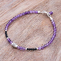 Amethyst and onyx beaded bracelet, 'Nexus in Purple' - Hand Threaded Amethyst and Onyx Beaded Bracelet